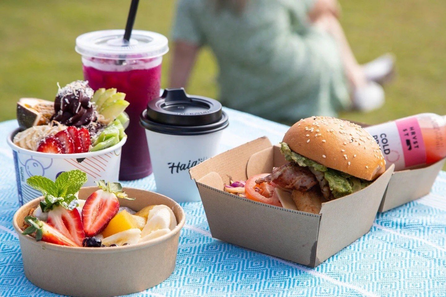 Haig Street picnic spread — burger, acai bowls and branded coffee by Kirra Beach