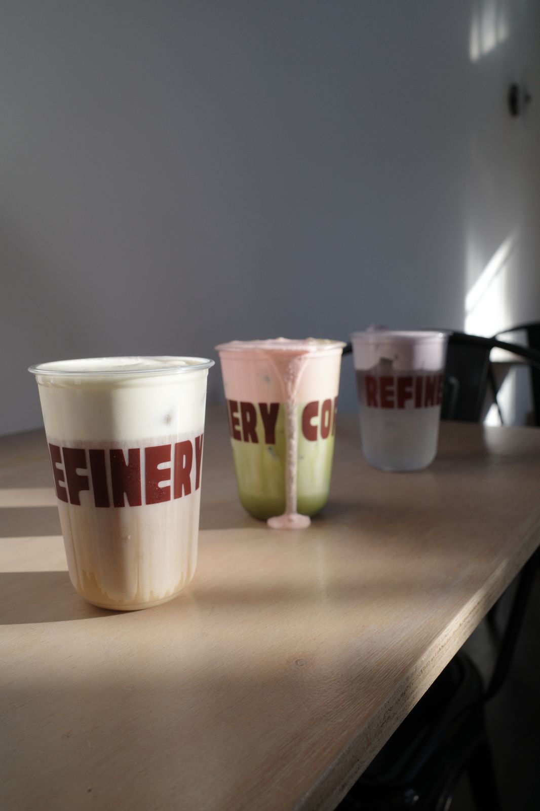 Refinery cold foam drinks styled on a timber bench