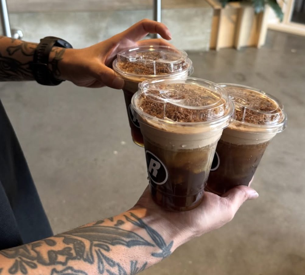 Relaxed Espresso cold foam drinks held up to camera