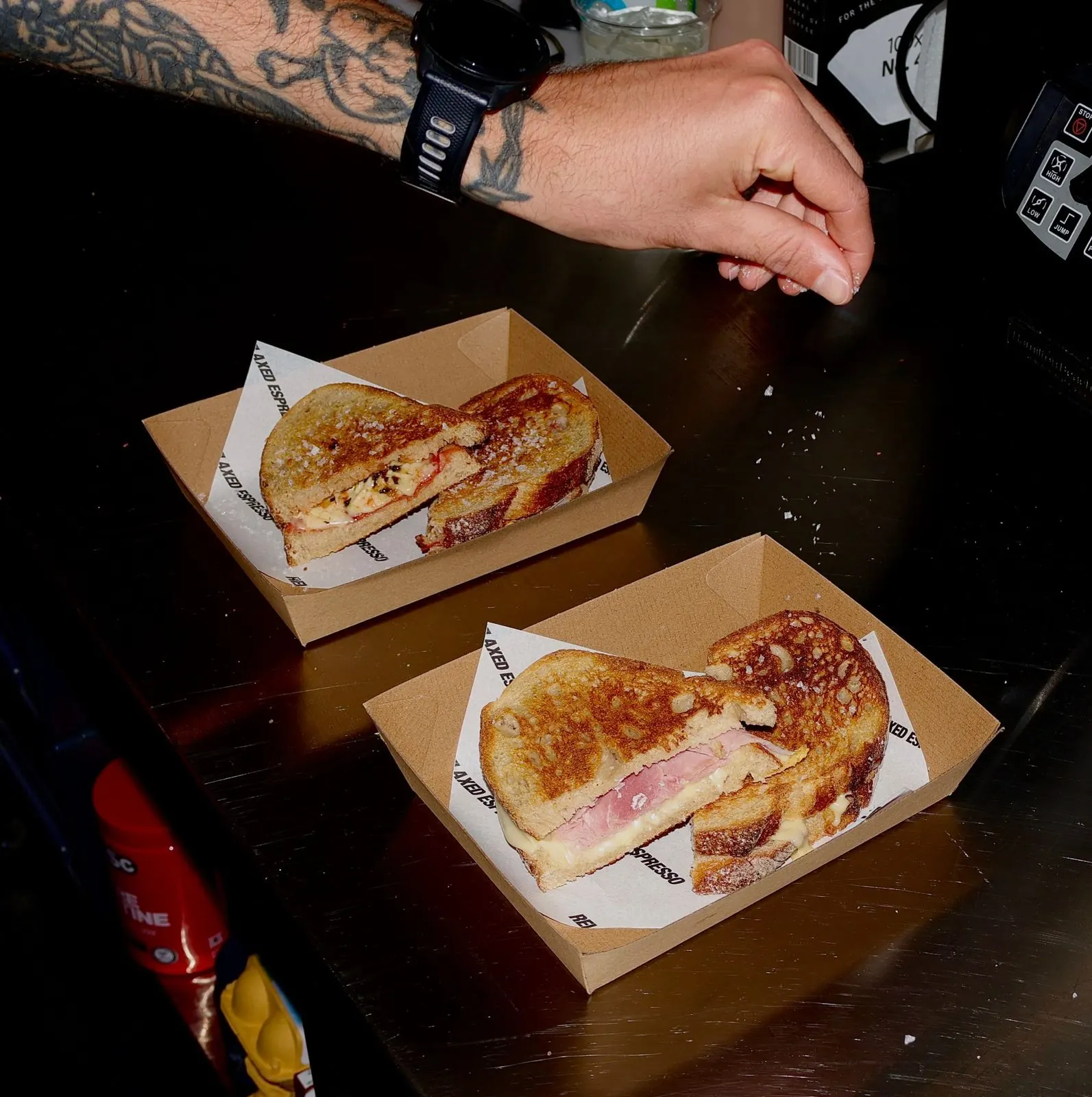 Two toasties on branded Relaxed Espresso paper, fresh off the press